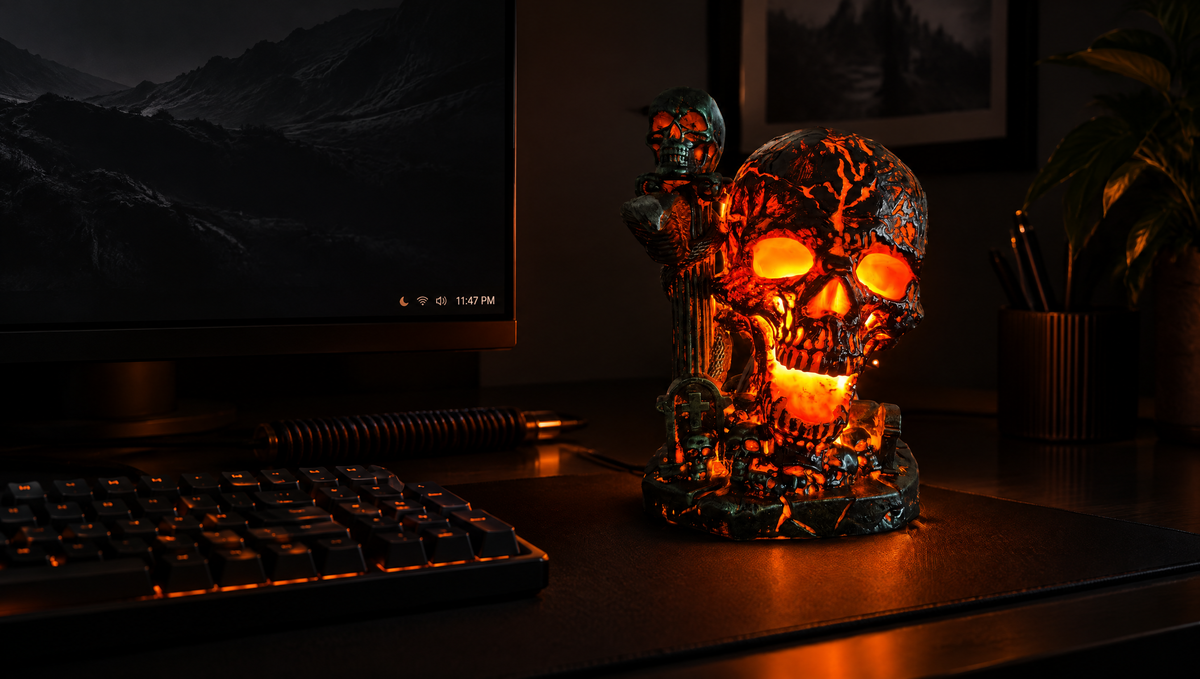 Ember Skull lamp as ambient light on a dark gaming desk setup